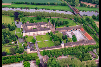 Aerial photograpy of UNESCO World Heritage Site Corvey Castle on the banks of the Weser with castle restaurant, Weser-Aktivhotel-Corvey and Remtergarten State Garden Show Höxter in Höxter in the state North Rhine-Westphalia, Germany