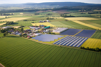 Panel rows of photovoltaic and solar farm or solar power plant in the district Bredenborn in Marienmuenster in the state North Rhine-Westphalia