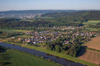 Village on the river bank areas of the Weser river in Wehrden in the state North Rhine-Westphalia, Germany
