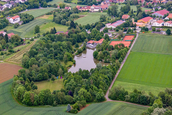 Swimming lake at the old swimming pool in Arnstein in the state Bavaria, Germany