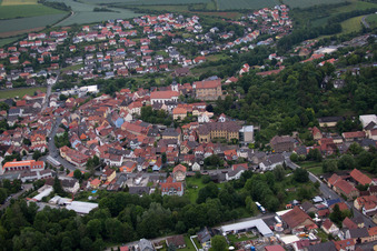 Town View of the streets and houses of the residential areas in Arnstein in the state Bavaria out of the air