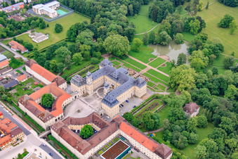 Castle park and castle Werneck with castle church and Albert Schweitzer House in Werneck in the state Bavaria, Germany seen from above