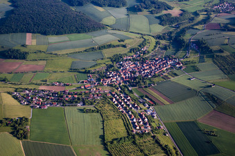 Village - view on the edge of agricultural fields and farmland in Unteraltertheim in the state Bavaria, Germany