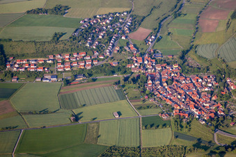 Aerial view of Village - view on the edge of agricultural fields and farmland in Unteraltertheim in the state Bavaria, Germany