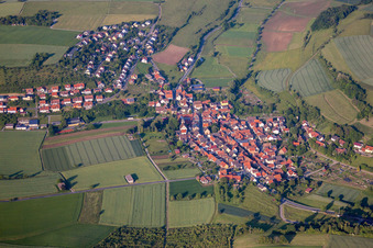 Aerial photograpy of Village - view on the edge of agricultural fields and farmland in Unteraltertheim in the state Bavaria, Germany