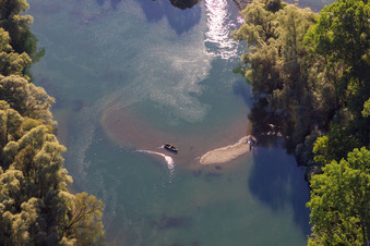 Fishing boat on a sandbank in Judengasse in the Rheinauen Bremengrund in Au am Rhein in the state Baden-Wuerttemberg, Germany