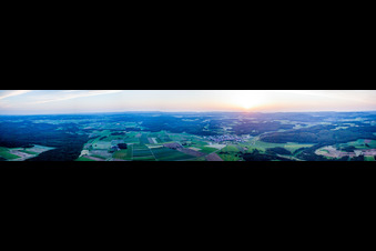 Panoramic perspective at sunset of Village - view on the edge of agricultural fields and farmland in Hayingen in the state Baden-Wurttemberg, Germany