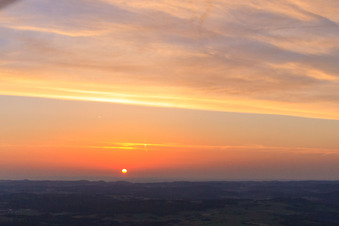 Aerial view of Sunset colors the sky over the Swabian Alb red orange in Hayingen in the state Baden-Wuerttemberg, Germany