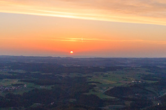 Aerial photograpy of Sunset colors the sky over the Swabian Alb red orange in Hayingen in the state Baden-Wuerttemberg, Germany