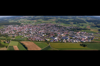 Panoramic perspective Village - view on the edge of agricultural fields and farmland in Laichingen in the state Baden-Wurttemberg, Germany