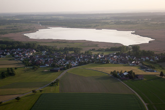 Aerial view of Village in front of the Federsee with pile dwellings in Tiefenbach in the state Baden-Wuerttemberg, Germany