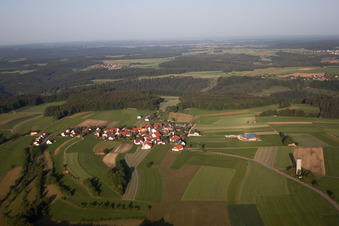 Aerial view of Village - view on the edge of agricultural fields and farmland in Bremelau in the state Baden-Wurttemberg