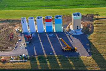 Aerial view of Interlocking segments of the masts of a wind turbine before assembly in Offenbach an der Queich in the state Rhineland-Palatinate, Germany