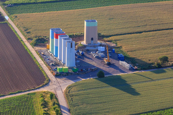 Oblique view of Interlocking segments of the masts of a wind turbine before assembly in Offenbach an der Queich in the state Rhineland-Palatinate, Germany