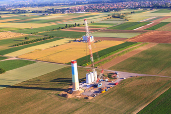 Aerial view of Segments of the mast of a wind turbine during assembly in Offenbach an der Queich in the state Rhineland-Palatinate, Germany