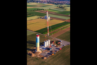 Oblique view of Segments of the mast of a wind turbine during assembly in Offenbach an der Queich in the state Rhineland-Palatinate, Germany