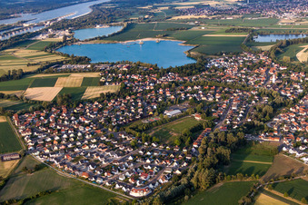Village on the lake bank areas of gravel lake in Offendorf in Grand Est, France