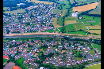 View of the town with railway tracks from the northwest in the district Opperz in Neuhof in the state Hesse, Germany