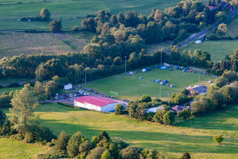 Football field with tent camp in the district Burkhards in Schotten in the state Hesse, Germany