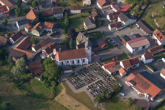 Grave rows on the grounds of the cemetery and church of in Oberleichtersbach in the state Bavaria, Germany
