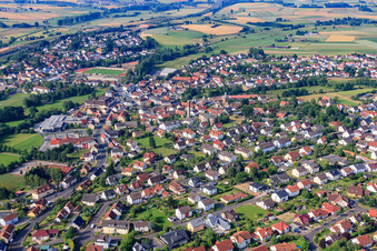 Overview of the town from the south with Saint Barbara in Neuhof in the state Hesse, Germany