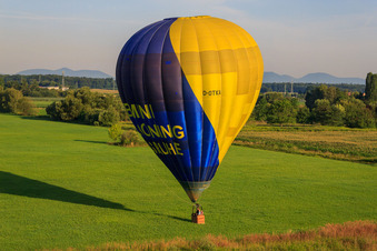 Landing of a hot air balloon D-OTKA in Erlenbach bei Kandel in the state Rhineland-Palatinate, Germany out of the air