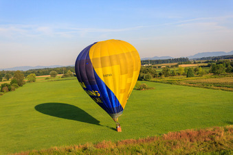 Landing of a hot air balloon D-OTKA in Erlenbach bei Kandel in the state Rhineland-Palatinate, Germany viewn from the air