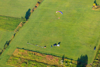 Landing of a hot air balloon D-OTKA in Erlenbach bei Kandel in the state Rhineland-Palatinate, Germany from the drone perspective