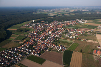 Aerial view of Village - view on the edge of agricultural fields and farmland in Hatzenbuehl in the state Rhineland-Palatinate, Germany