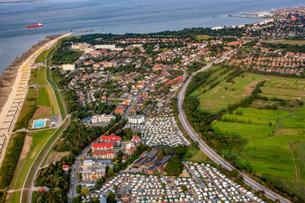 Rows of beach chairs on the sandy beach up to the Kugelbake in the coastal area of the North Sea with the campsites Wattenlöper and Nordsee in the foreground in the district Duhnen in Cuxhaven in the state Lower Saxony, Germany