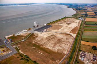 Aerial photograpy of Port facilities on the sea coast of Cuxport GmbH for offshore wind turbines in Cuxhaven in the state Lower Saxony, Germany