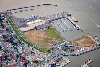Port facilities on the banks of the Landwehrkanal harbor basin and Alte Liebe lighthouse in Cuxhaven in the state Lower Saxony, Germany