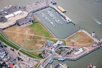 Aerial view of Port facilities on the banks of the Landwehrkanal harbor basin and Alte Liebe lighthouse in Cuxhaven in the state Lower Saxony, Germany
