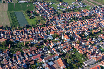 Aerial photograpy of Village - view on the edge of agricultural fields and farmland in Hatzenbuehl in the state Rhineland-Palatinate, Germany