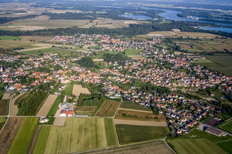 Aerial view of Village - view on the edge of agricultural fields and farmland in Sessenheim in Grand Est, France