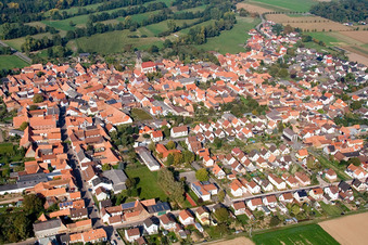 Aerial photograpy of Village - view on the edge of agricultural fields and farmland in Steinweiler in the state Rhineland-Palatinate