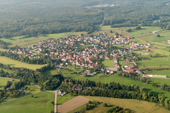 Aerial view of Village - view on the edge of agricultural fields and farmland in Forstfeld in Grand Est, France