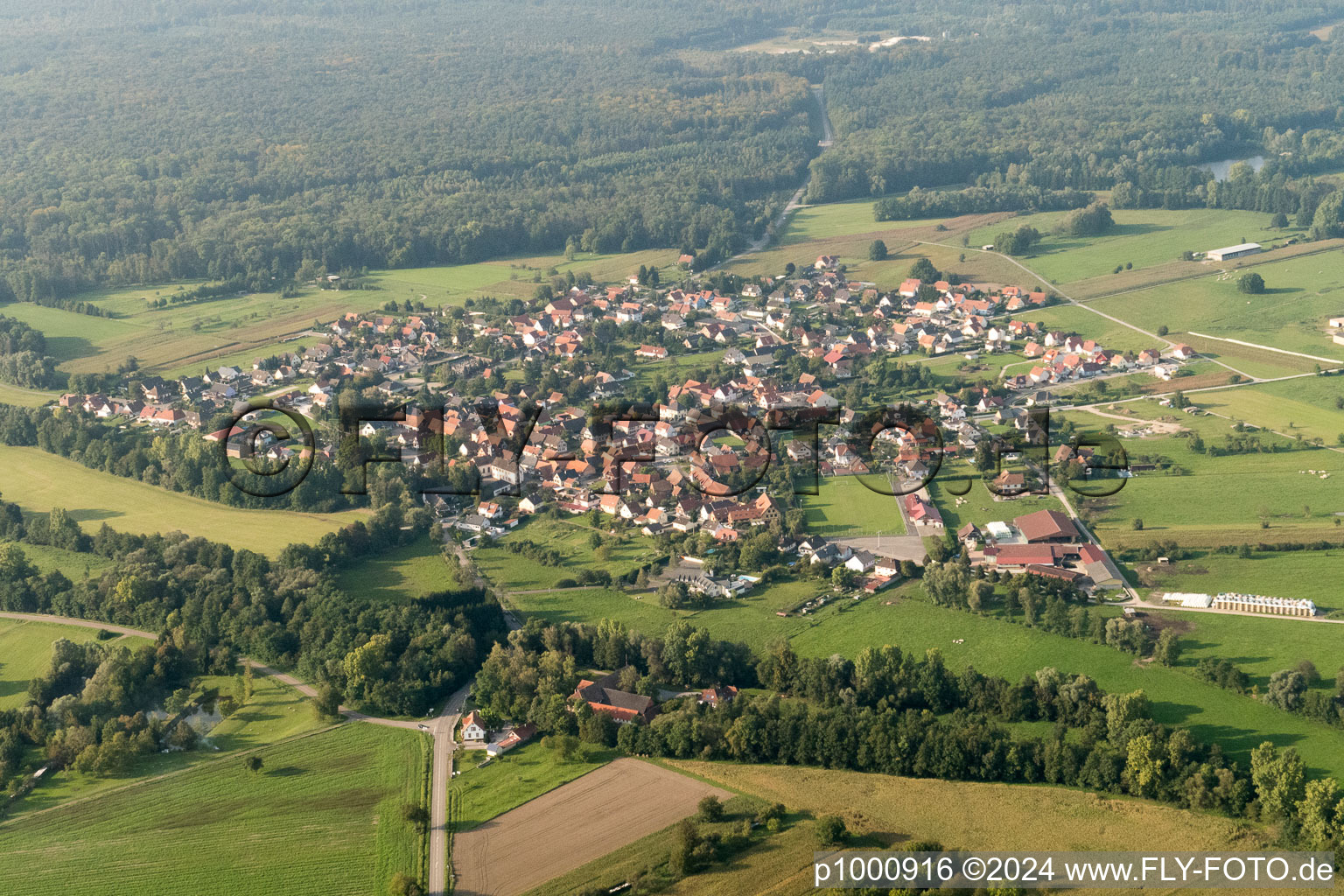 Aerial view of Village - view on the edge of agricultural fields and farmland in Forstfeld in Grand Est, France