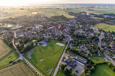 Village view on the edge of agricultural fields and land in Wesselburen in the state Schleswig-Holstein, Germany