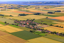 Aerial view of View of the town from the southeast showing the new Wollgrasweg development area under construction. in Neuenkirchen in the state Schleswig Holstein, Germany