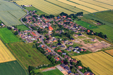 View of the town from the east showing the new Wollgrasweg development area under construction in Neuenkirchen in the state Schleswig Holstein, Germany