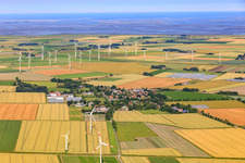 Village view from the east in front of the Wesselburenerkoog wind farm in Schülp in the state Schleswig Holstein, Germany