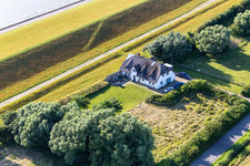 Thatched-roof house at Westerdeich in the district Westerdeich in Vollerwiek in the state Schleswig Holstein, Germany
