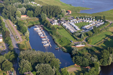 Pleasure boat marina of Motorbootclub Westkueste e.V. with docks and moorings on the shore area of Westersielzug in Friedrichstadt in the state Schleswig-Holstein, Germany