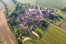 Agricultural land and field boundaries surround the settlement area of the village in Eberstaedt in the state Thuringia, Germany