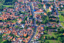 Town center with St. Peter's Church on the main street in the district Goldbach in Nessetal in the state Thuringia, Germany