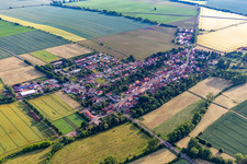Agricultural land and field boundaries surround the settlement area of the village in Westhausen in the state Thuringia, Germany