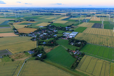 Village view in front of the wind farm Schülp from the southwest in Schülp in the state Schleswig Holstein, Germany