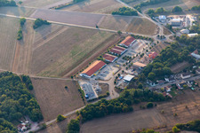 Buildings of the shopping center Muehlaecker with Netto Filiale, TEDi, PENNY, DEICHMANN and Bau-Solar Suedwest GmbH for the French customers in Neulauterburg in the state Rhineland-Palatinate, Germany
