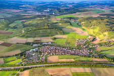 Village - view behind motorway A3 on the edge of agricultural fields and farmland in the district Dertingen in Wertheim in the state Baden-Wurttemberg